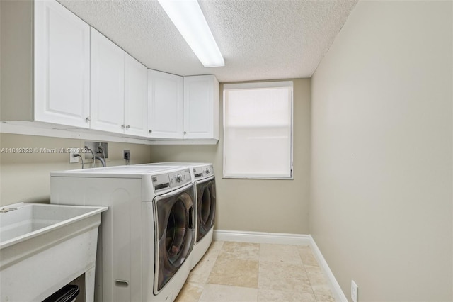 15050 E Falcons Lea Dr, Davie, FL 33331 - laundry area featuring cabinet space, independent washer and dryer, baseboards, and a textured ceiling