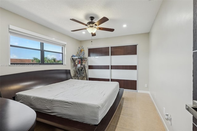 15050 E Falcons Lea Dr, Davie, FL 33331 - bedroom featuring recessed lighting, baseboards, light tile patterned flooring, a ceiling fan, and a closet