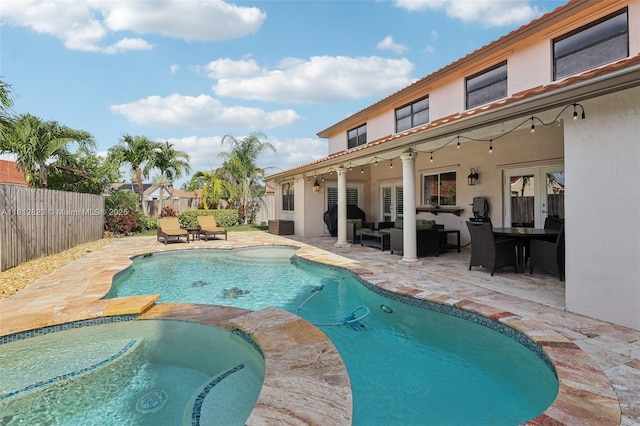 15050 E Falcons Lea Dr, Davie, FL 33331 - view of pool with a fenced backyard, a patio, outdoor lounge area, central AC unit, and a pool with connected hot tub