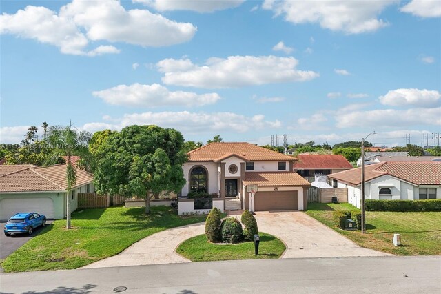 15050 E Falcons Lea Dr, Davie, FL 33331 - mediterranean / spanish-style house with a tiled roof, driveway, a garage, and stucco siding