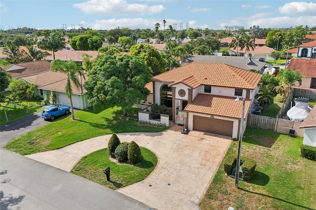 15050 E Falcons Lea Dr, Davie, FL 33331 - view of front facade with driveway, a residential view, a tiled roof, and stucco siding