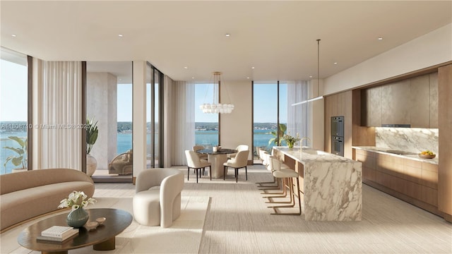 7918 W Dr Unit 701, North Bay Village, FL 33141 - living room with a wall of windows, healthy amount of natural light, a chandelier, and a water view