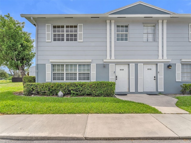 1849 SW 81st Way Unit 1-24, Davie, FL 33324 - view of property featuring a front yard and stucco siding
