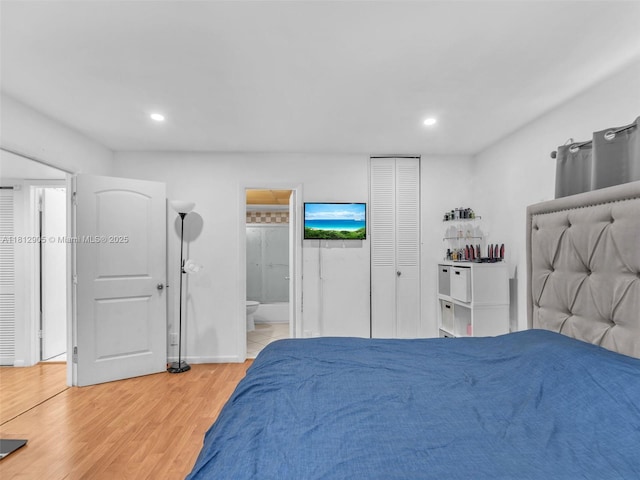 1849 SW 81st Way Unit 1-24, Davie, FL 33324 - bedroom with light wood-style flooring, recessed lighting, and connected bathroom
