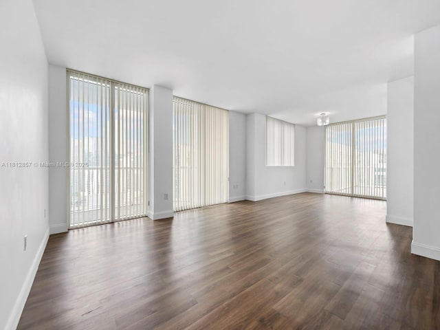 253 NE 2nd St Unit 3108, Miami, FL 33132 - spare room featuring dark wood-style floors and baseboards