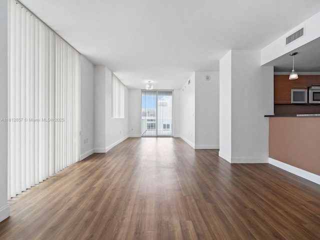 253 NE 2nd St Unit 3108, Miami, FL 33132 - unfurnished living room with wood finished floors and baseboards