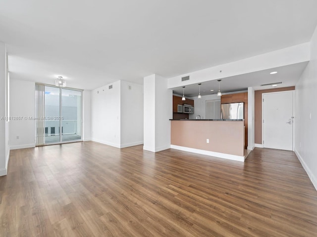 253 NE 2nd St Unit 3108, Miami, FL 33132 - unfurnished living room with dark wood-type flooring and baseboards