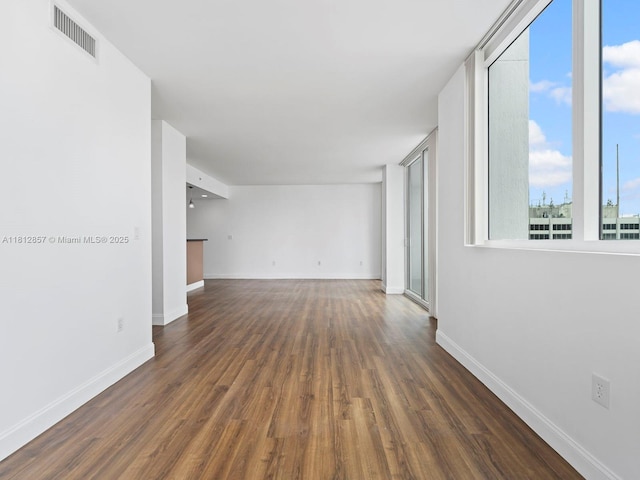 253 NE 2nd St Unit 3108, Miami, FL 33132 - empty room featuring dark wood-type flooring and baseboards