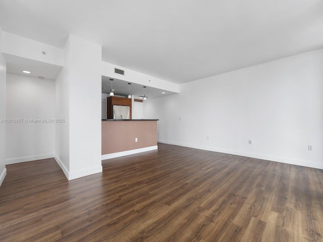 253 NE 2nd St Unit 3108, Miami, FL 33132 - unfurnished living room featuring dark wood-type flooring and baseboards