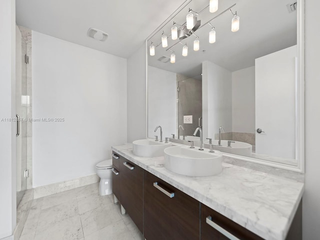 253 NE 2nd St Unit 3108, Miami, FL 33132 - full bathroom with double vanity, a shower stall, toilet, and baseboards