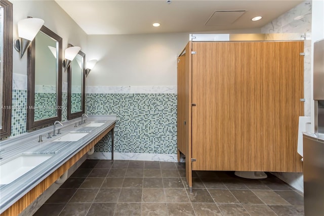 253 NE 2nd St Unit 3108, Miami, FL 33132 - full bathroom with tile walls, wainscoting, double vanity, tile patterned flooring, and recessed lighting