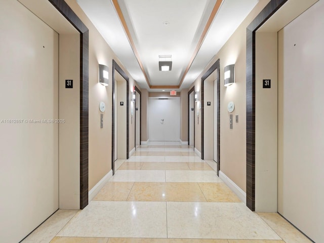 253 NE 2nd St Unit 3108, Miami, FL 33132 - corridor with elevator, a raised ceiling, and light tile patterned floors