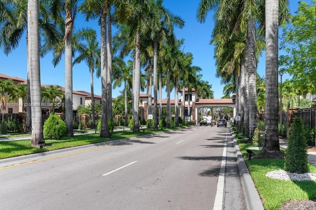 10023 NW 89th Ter, Doral, FL 33178 - view of asphalt road featuring curbs and a residential view