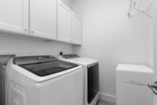 10023 NW 89th Ter, Doral, FL 33178 - washroom with washer and clothes dryer, cabinet space, and baseboards