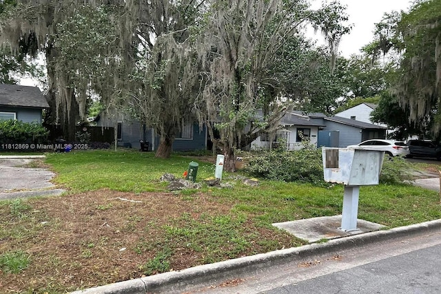 2927 SW 39th Ave, Gainesville, FL 32608 - obstructed view of property featuring a front lawn