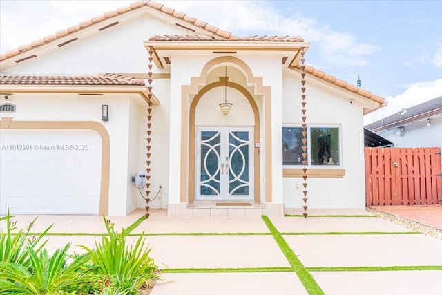 8902 NW 148th St, Miami Lakes, FL 33018 - view of front of house featuring stucco siding, a garage, and a tiled roof