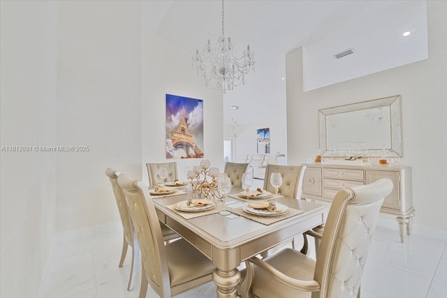 8902 NW 148th St, Miami Lakes, FL 33018 - dining area with a chandelier, light marble finish flooring, baseboards, and a towering ceiling