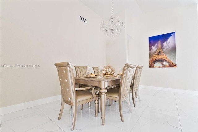 8902 NW 148th St, Miami Lakes, FL 33018 - dining space with marble look tile flooring, a chandelier, and baseboards