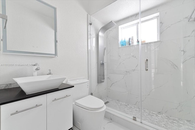 8902 NW 148th St, Miami Lakes, FL 33018 - full bath featuring a marble finish shower, toilet, vanity, and a textured wall