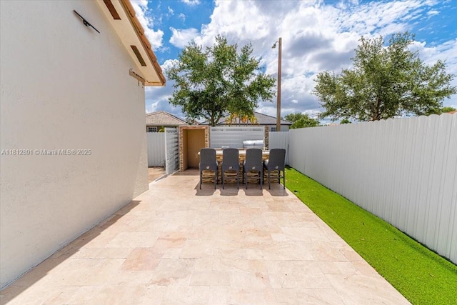 8902 NW 148th St, Miami Lakes, FL 33018 - fenced backyard featuring a patio area and outdoor dining area