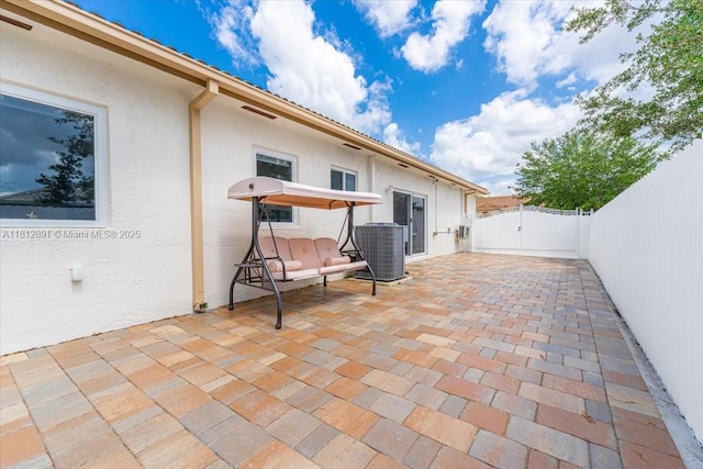 8902 NW 148th St, Miami Lakes, FL 33018 - fenced backyard featuring a gate, central AC unit, and a patio