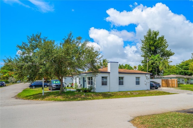 504 SW 5th Ave, Hallandale Beach, FL 33009 - single story home featuring a chimney and stucco siding