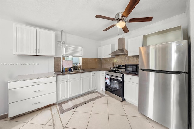 504 SW 5th Ave, Hallandale Beach, FL 33009 - kitchen with appliances with stainless steel finishes, wall chimney exhaust hood, a sink, decorative backsplash, and ceiling fan