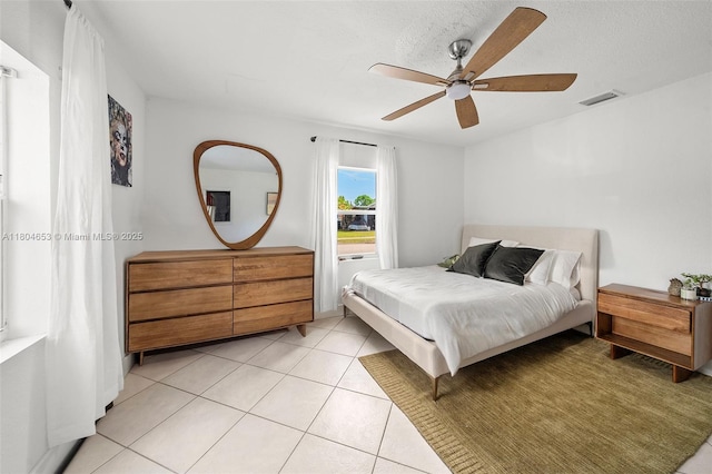 504 SW 5th Ave, Hallandale Beach, FL 33009 - bedroom with a ceiling fan and light tile patterned floors