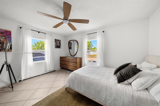 504 SW 5th Ave, Hallandale Beach, FL 33009 - bedroom with light tile patterned floors and a ceiling fan