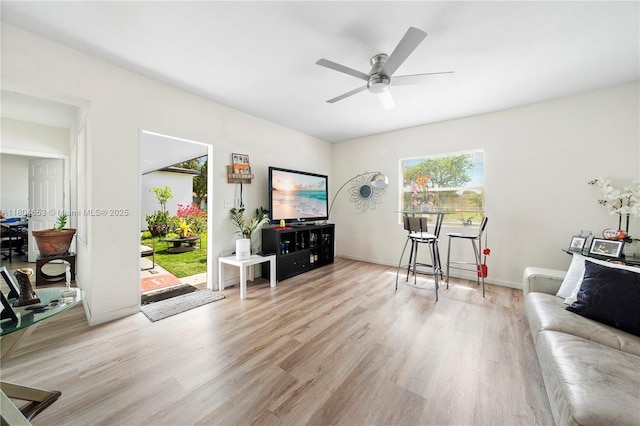 504 SW 5th Ave, Hallandale Beach, FL 33009 - living room with ceiling fan, wood finished floors, and baseboards
