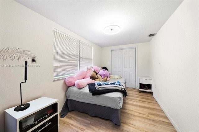 504 SW 5th Ave, Hallandale Beach, FL 33009 - bedroom featuring light wood-style flooring, a closet, and baseboards