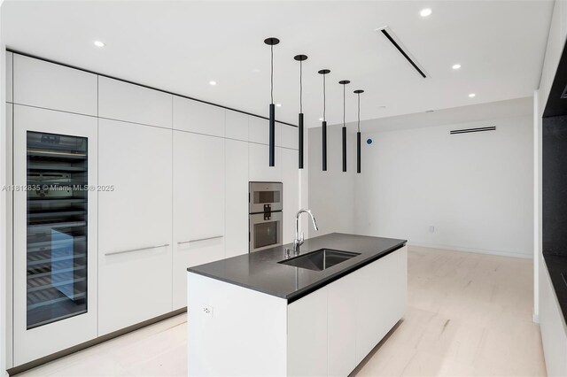 300 Biscayne Boulevard Way Unit 1904C, Miami, FL 33131 - kitchen with a sink, modern cabinets, dark countertops, white cabinets, and recessed lighting