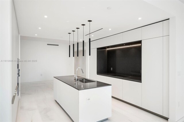 300 Biscayne Boulevard Way Unit 1904C, Miami, FL 33131 - kitchen with a sink, modern cabinets, white cabinetry, dark countertops, and recessed lighting