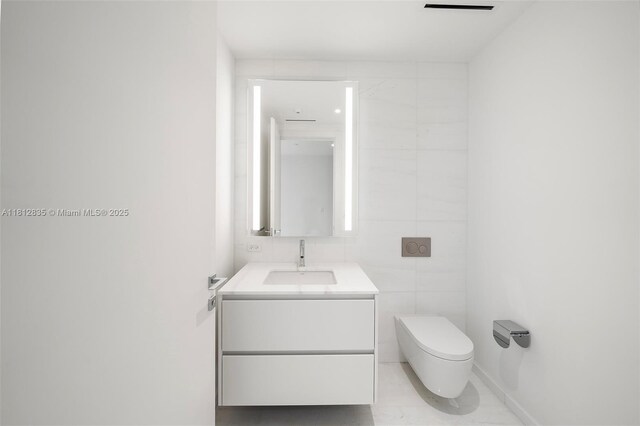 300 Biscayne Boulevard Way Unit 1904C, Miami, FL 33131 - half bath featuring vanity, toilet, and tile walls