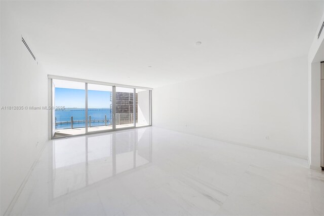 300 Biscayne Boulevard Way Unit 1904C, Miami, FL 33131 - spare room featuring expansive windows and a water view