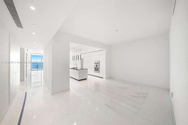 300 Biscayne Boulevard Way Unit 1904C, Miami, FL 33131 - unfurnished living room featuring light marble finish flooring, recessed lighting, and a sink