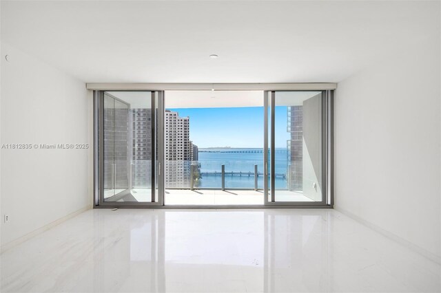 300 Biscayne Boulevard Way Unit 1904C, Miami, FL 33131 - spare room with baseboards and a water view