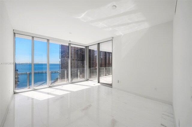 300 Biscayne Boulevard Way Unit 1904C, Miami, FL 33131 - empty room with a water view and expansive windows