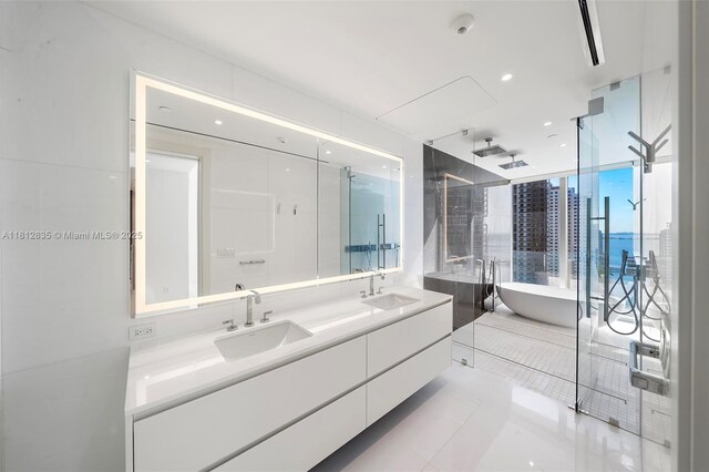 300 Biscayne Boulevard Way Unit 1904C, Miami, FL 33131 - full bath with double vanity, a soaking tub, a shower stall, and tile patterned floors