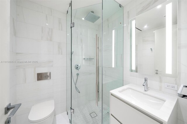 300 Biscayne Boulevard Way Unit 1904C, Miami, FL 33131 - bathroom featuring tile walls, a shower stall, vanity, and toilet