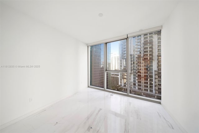 300 Biscayne Boulevard Way Unit 1904C, Miami, FL 33131 - unfurnished room with expansive windows, baseboards, and a view of city
