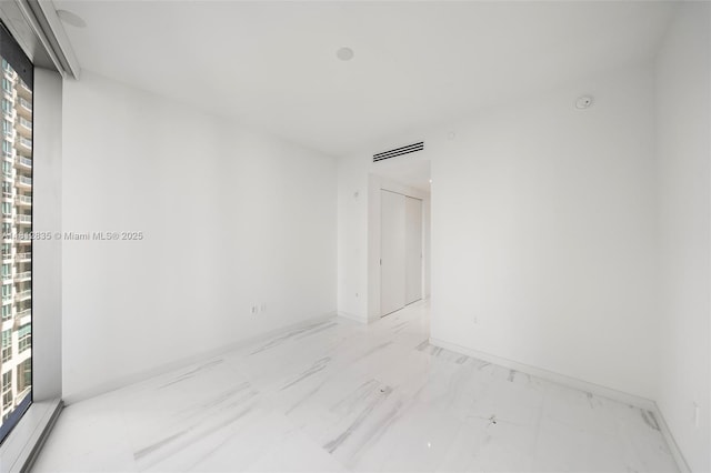 300 Biscayne Boulevard Way Unit 1904C, Miami, FL 33131 - spare room featuring marble finish floors and baseboards