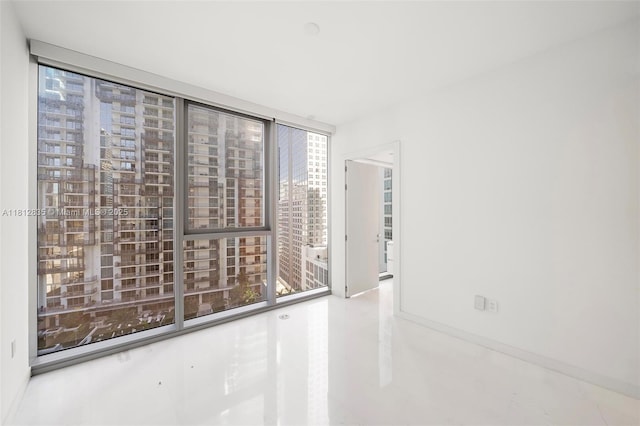 300 Biscayne Boulevard Way Unit 1904C, Miami, FL 33131 - empty room featuring baseboards, tile patterned flooring, and floor to ceiling windows