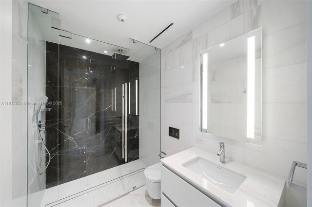 300 Biscayne Boulevard Way Unit 1904C, Miami, FL 33131 - bathroom featuring tile walls, a marble finish shower, vanity, and toilet