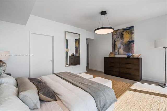 500 Alton Rd Unit 1603, Miami Beach, FL 33139 - bedroom featuring wood finished floors and baseboards