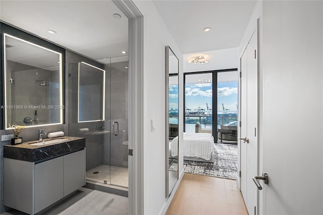 500 Alton Rd Unit 1603, Miami Beach, FL 33139 - full bathroom with ensuite bathroom, vanity, a shower stall, and wood finished floors
