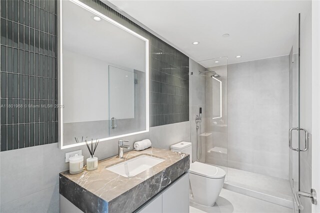 500 Alton Rd Unit 1603, Miami Beach, FL 33139 - full bathroom with a stall shower, vanity, toilet, and recessed lighting