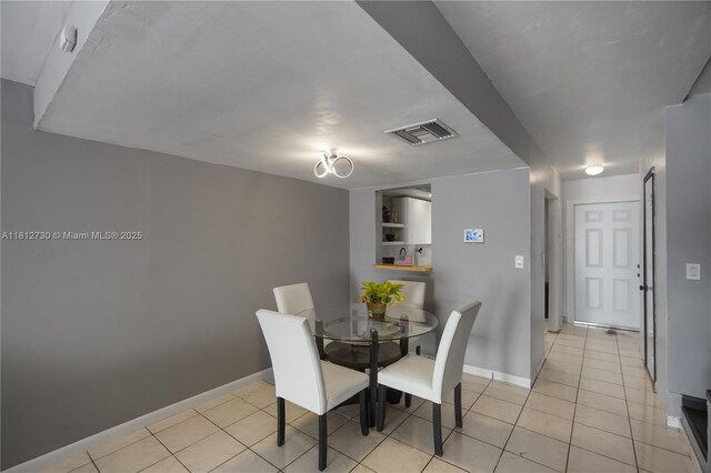 8022 SW 151st Ct Unit 603, Miami, FL 33193 - dining room with baseboards and light tile patterned flooring