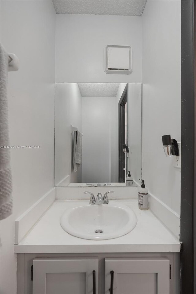 8022 SW 151st Ct Unit 603, Miami, FL 33193 - bathroom featuring vanity and a textured ceiling