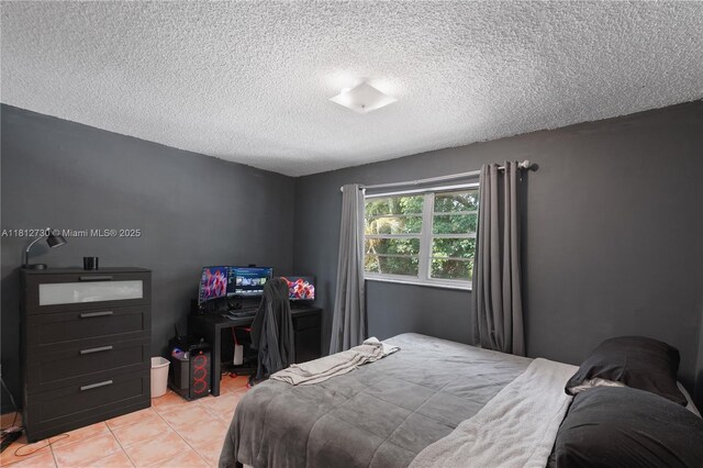 8022 SW 151st Ct Unit 603, Miami, FL 33193 - bedroom featuring a textured ceiling and light tile patterned floors